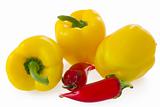 Three fresh yellow bell pepper  and glass chilli peppers isolated on white background