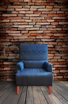 old single sofa seat in front of the wall