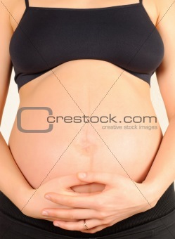 pregnant woman embracing the belly
