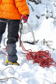 Young man, ice climbing an attractive route.