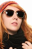 cool redhead woman wearing sunglasses in winter dress