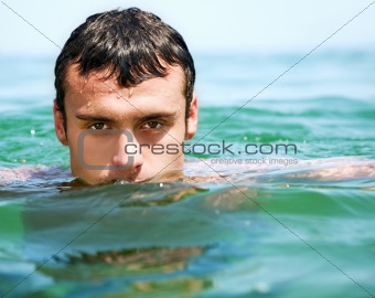Man swimming sea