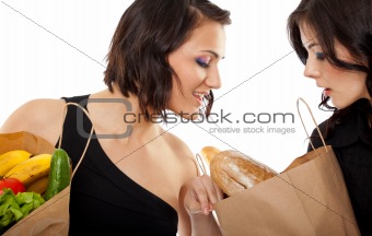 girlfriends looking in shopping bag