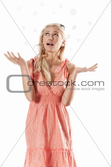 blond beautiful girl standing against white background