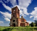 Abandoned church in field