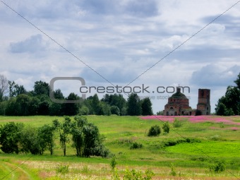 Abandoned church in field