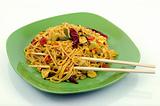 spicy asian noodles with chopsticks