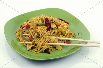 spicy asian noodles with chopsticks