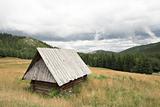 Old wooden hut in the mountains