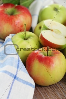 Red and green apples with leaves 