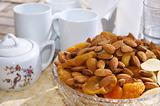 Nuts and dried fruits with a tea set