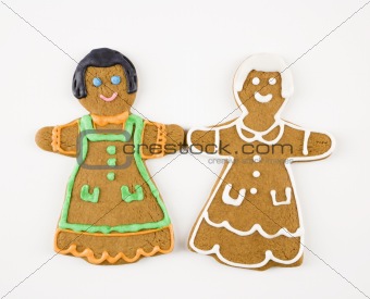 Girl cookies holding hands.