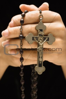 Hands and rosary.