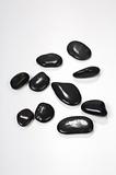 Zen-like black stones isolated on white