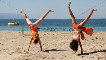 Two girls doing cartwheel