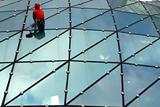 Climber on glass roof 