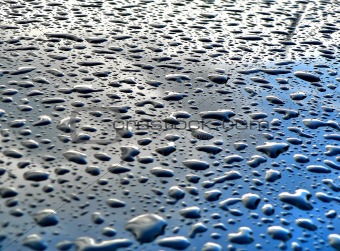 rain drops on metallic surface