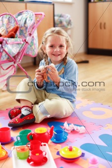 Cute girl playing with toys