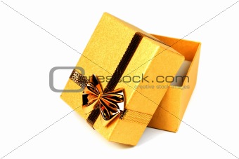 Opened gold shining gift box isolated on white.