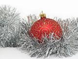 Red christmas ball and silver tinsel
