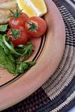 Earthenware plate and salad close crop