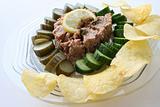 Tuna fish with pickles , chips in dish