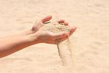 Sand running through hands