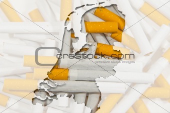 Outline map of Netherlands with cigarettes in background