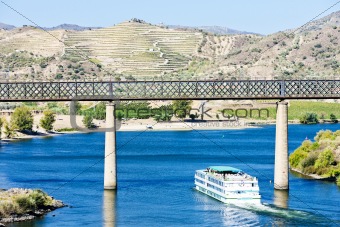 railway viaduct and cruise ship in Pocinho, Douro Valley, Portugal