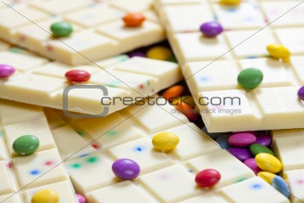 still life of white chocolate with smarties