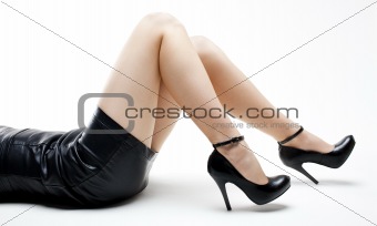 detail of lying woman wearing black shoes