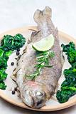 bream baked with Italian herbs and fried spinach