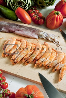 still life of raw seafood and vegetables