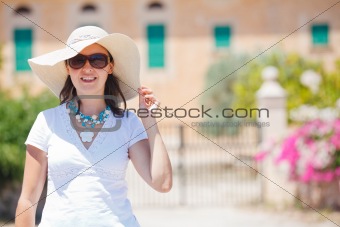 Beautiful young summer woman in hat