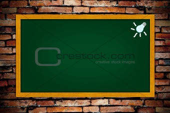 light bulb on green blackboard