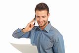 Happy and confident businessman on the phone