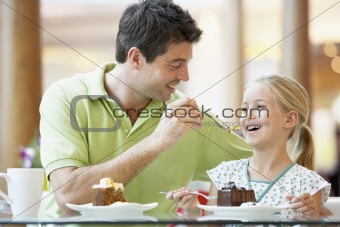 Father And Daughter Having Lunch Together At The Mall