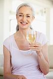 Woman Enjoying A Glass Of White Wine