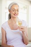 Woman Enjoying A Glass Of White Wine