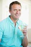 Man Enjoying A Glass Of White Wine