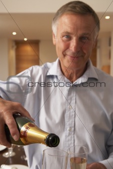 Man Pouring A Glass Of Champagne