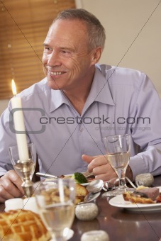 Man Eating Dinner At Home