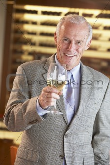 Man Having A Drink At A Bar