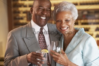 Couple Enjoying A Drink At A Bar Together