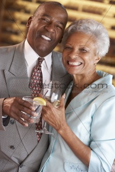 Couple Enjoying A Drink At A Bar Together