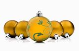Golden christmas baubles on white background with space for text