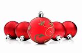 christmas baubles on white background with space for text