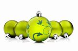 Green christmas baubles on white background with space for text