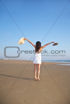 happy jumping woman at Castilnovo Beach