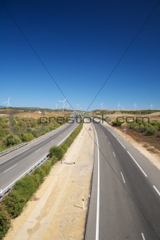 road with white windmills